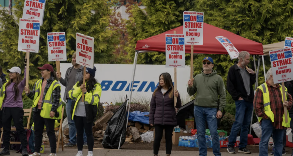 S&P Downgrades Boeing’s Credit Rating at Strike Enters 4th Week  - 1,600 Asheville Nurses Win 1st Contract - Chippendales Unionize