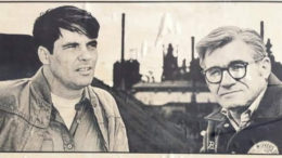 A young "Oil Can" Eddie Sadlowski on the left looking off into the distance with Jim Balanoff on the right staring at the camera with a steel mill in the background.